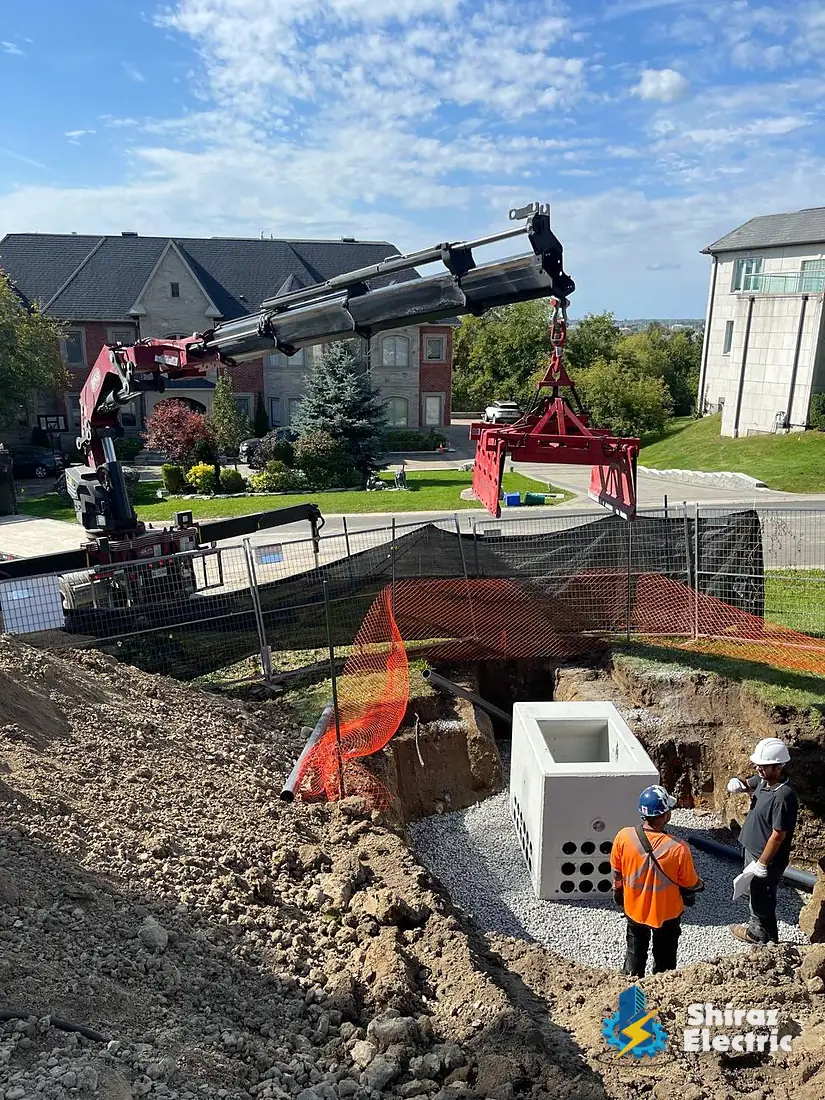 Underground service vault being set by crane